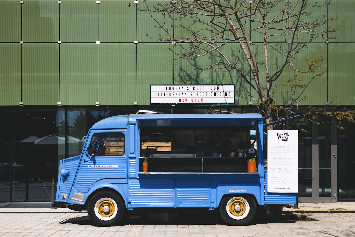 A bright blue food truck ready to serve